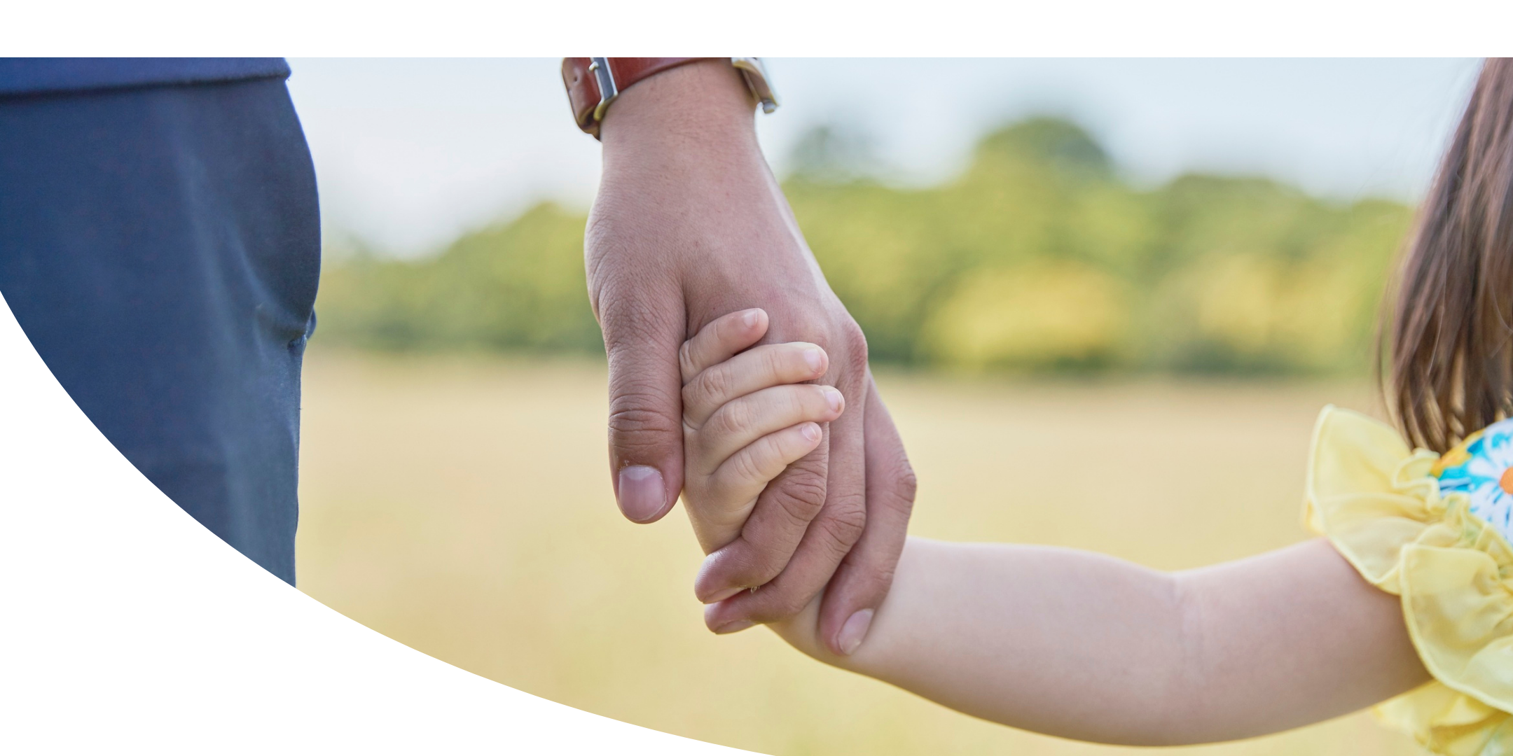 adult holding child's hand